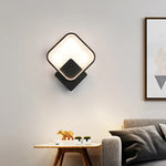 Applique murale LED ronde éclairant un salon contemporain