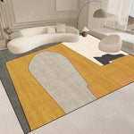 Le tapis de salon moderne dans des tons neutres et géométriques ajoute une belle touche de style épuré et minimaliste à cet espace de vie.