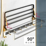 Détail de la finition oxydée noir et or du porte-serviettes