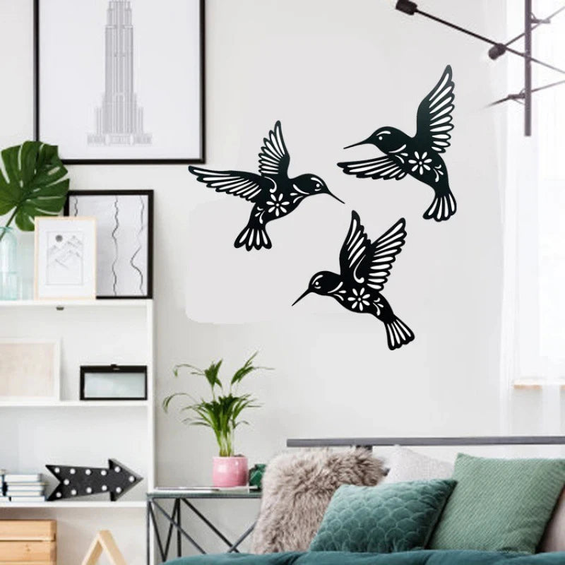 Ensemble de 3 colibris métal noir sur mur blanc