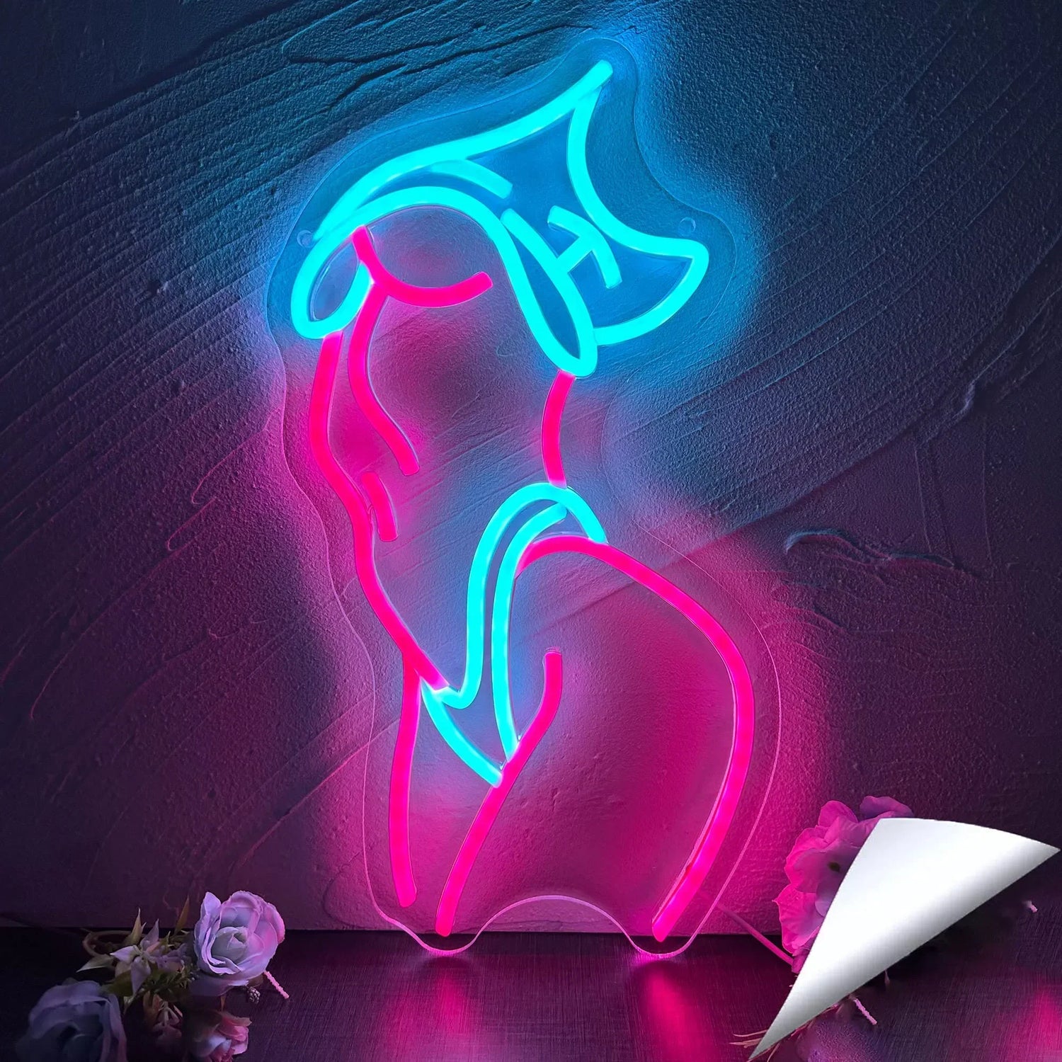 Enseigne au néon LED rose allumée dans une chambre moderne