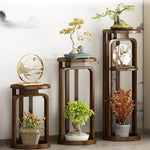 Support de fleurs en bambou vintage avec plante verte