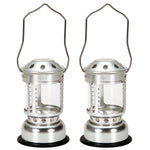 Lanterne à bougie portable en alliage aluminium couleur or posée sur une table de camping