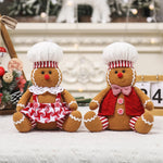 Grand couple bonhomme pain d'épice assis décoration Noël
