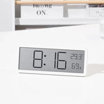 Vue de profil de l'horloge digitale montrant son design épuré
