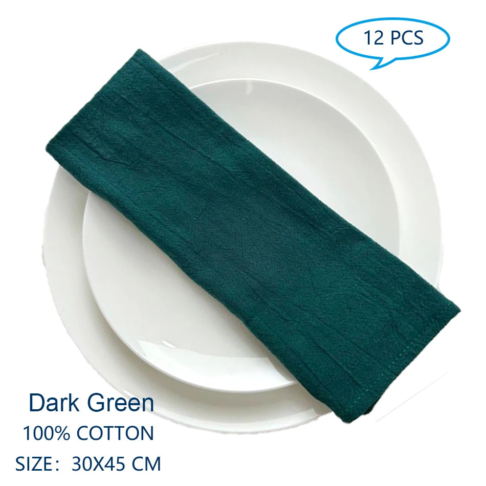 Serviettes de table en coton de couleur vert foncé, mesurant 30 x 45 cm, vendues en paquet de 12 pièces.
