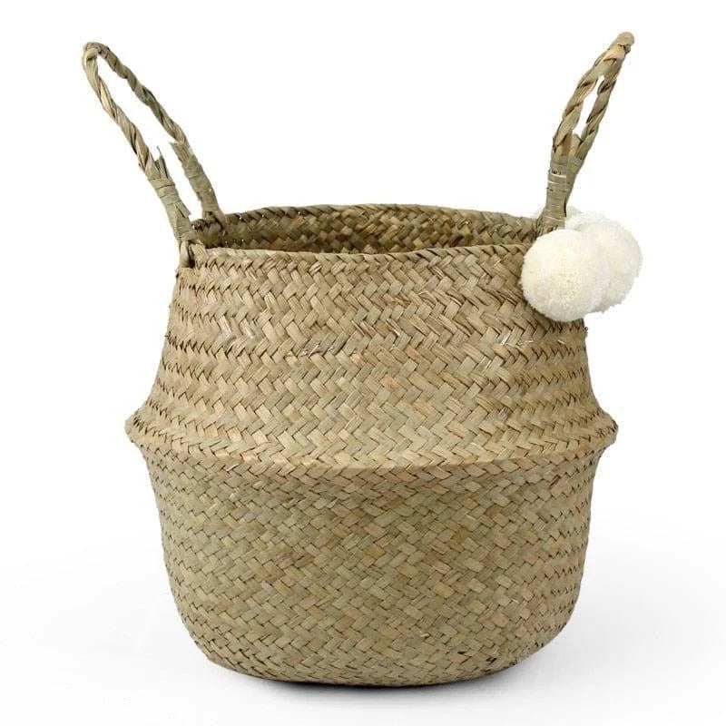 Panier de rangement élégant avec anses, parfait pour une décoration naturelle de la maison. Idéal pour organiser divers objets dans le salon, la chambre ou la salle de bain. Accessoire déco tendance avec des pompons décoratifs.
