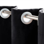 Rideau décoratif noir avec œillets pour tringle, idéal pour chambre ou salon, offrant élégance et modernité.