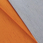 Rideau moderne bicolore avec design élégant en teinte orange et gris, ajout de style chic à tout intérieur. Idéal pour le salon ou la chambre.