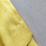 Rideau moderne deux tons jaune et gris, design élégant pour intérieur, solution esthétique pour la décoration de fenêtre, idéale pour salon et chambre, facile à assortir avec divers styles d'ameublement, parfait pour ajouter une touche de couleur et de luminosité.
