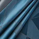 Tissu bleu avec motif géométrique élégant, idéal pour la décoration intérieure raffinée. Design contemporain et harmonieux, parfait pour un style moderne et chic.