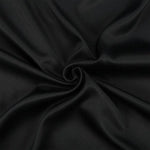 Tissu noir élégant pour décoration et confection, idéal pour projets de couture créatifs et création de vêtements tendance. Sa couleur intemporelle s'adapte parfaitement à tout style. Parfait pour designers et amateurs de mode recherchant une touche sophistiquée.
