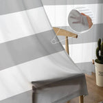 Voilage rayé gris et blanc pour décoration intérieure moderne, apportant une ambiance lumineuse et élégante à votre salon ou chambre. Nouveauté tendance pour habiller vos fenêtres avec style. Idéal pour créer un espace chaleureux et accueillant.