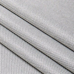 Tissu gris aux motifs texturés, idéal pour la décoration intérieure et la confection de vêtements modernes, avec un design élégant et contemporain. Parfait pour apporter une touche sophistiquée à tout projet de couture ou d'aménagement, ce textile se distingue par sa finesse et son allure chic.