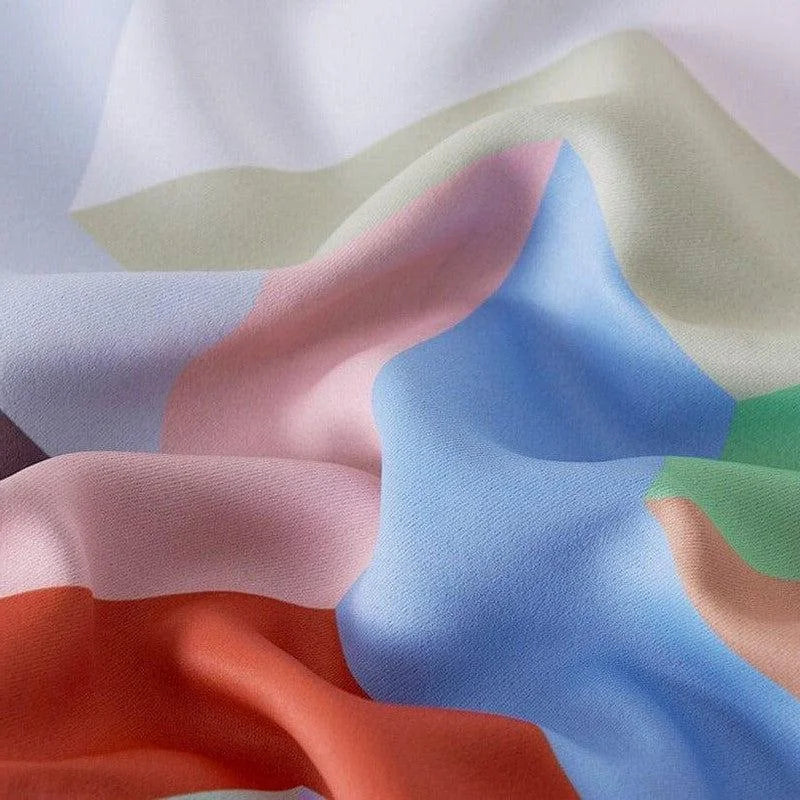 Écharpe élégante aux couleurs pastel attirantes, combinant des teintes de bleu, rose, vert et orange. Accessoire de mode polyvalent, ajout de couleur et de style à toute tenue féminine ou masculine. Idéal pour les occasions décontractées ou formelles. Cadeau parfait pour les amoureux de la mode.