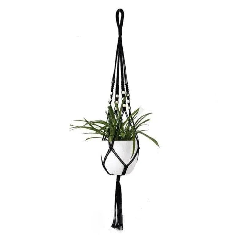 Porte-plante suspendu noir avec pot blanc et plante verte, idéal pour décoration intérieure moderne et épurée. Convient parfaitement pour ajouter une touche végétale dans un salon, une chambre ou un bureau. Solution pratique et esthétique pour optimiser l'espace tout en embellissant votre intérieur.