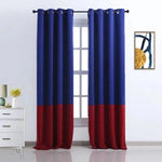 Image d'un élégant rideau bicolore avec anneaux en métal, idéal pour un salon moderne. Ce rideau bleu et rouge apporte une touche de couleur et de sophistication à votre intérieur. Installé devant une fenêtre, il offre une ambiance chaleureuse et contemporaine à toute pièce de la maison. Parfait pour créer une atmosphère accueillante et stylée.